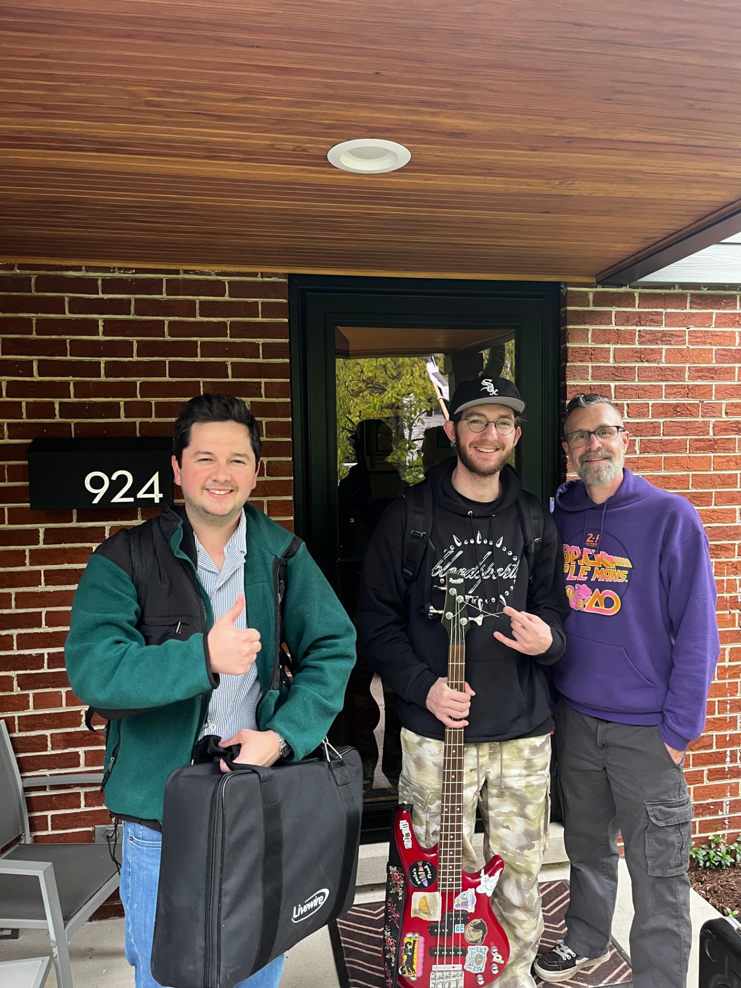 Michael Fahy, Dan Switalski and James Scott on a porch with gear